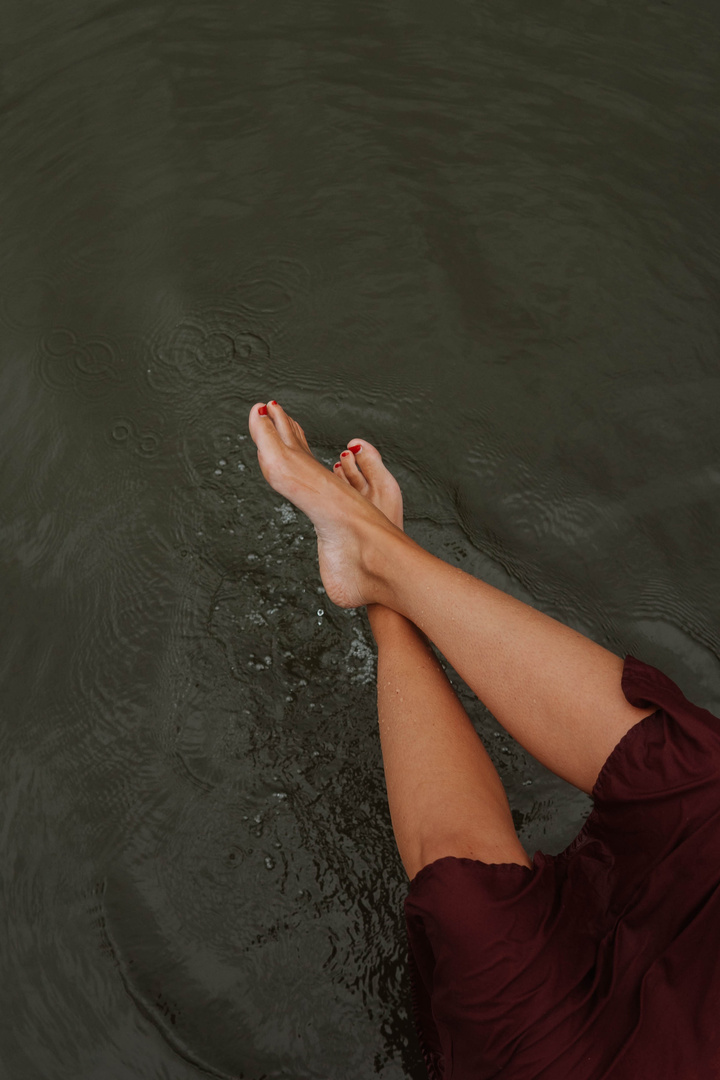 Person in Red Shorts Standing on Water